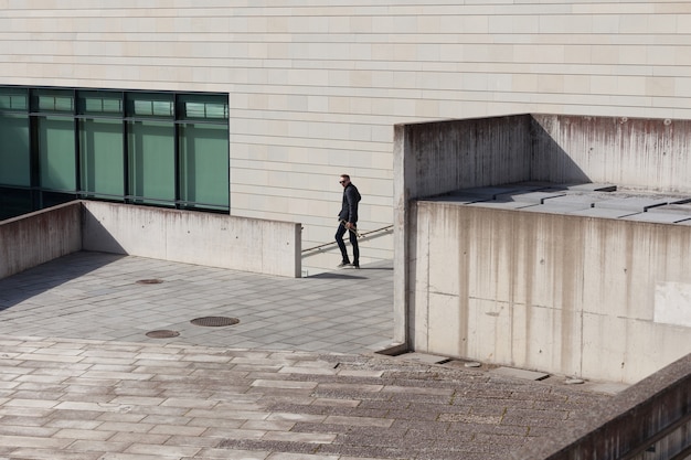 Free Photo musician walking downstairs