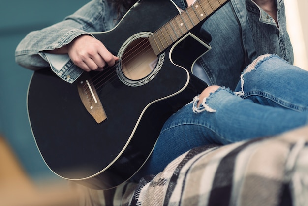 Free photo musician with black guitar