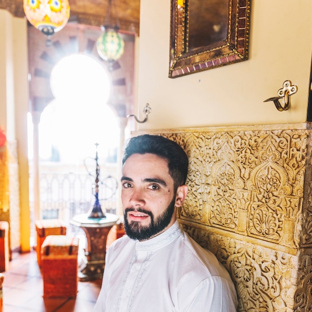 Free Photo muslim man sitting in restaurant