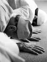 Free photo muslim people praying in sujud posture