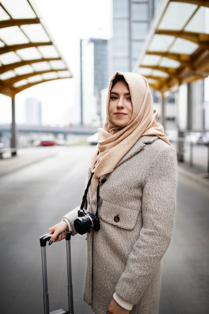 Muslim person travelling through the city