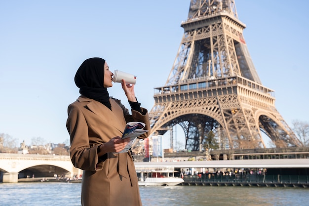 Free photo muslim woman traveling in paris