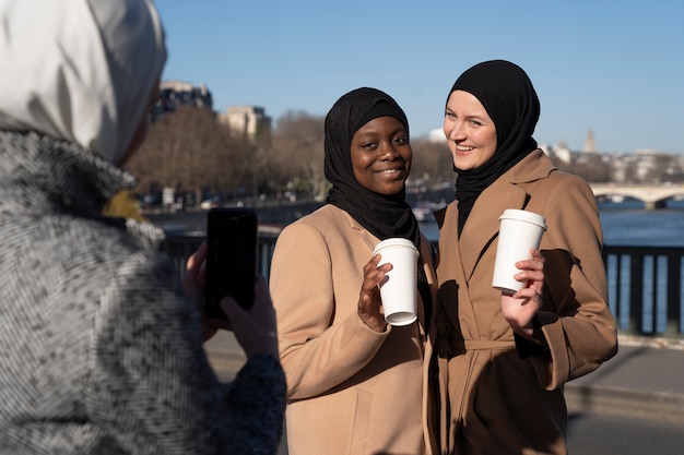 Free Photo muslim women traveling in paris together