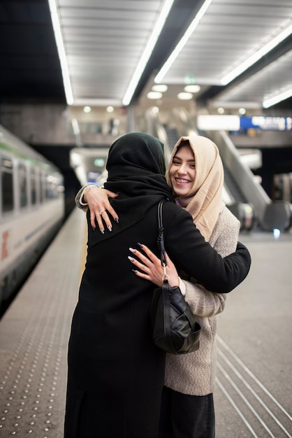 Free photo muslim women traveling together