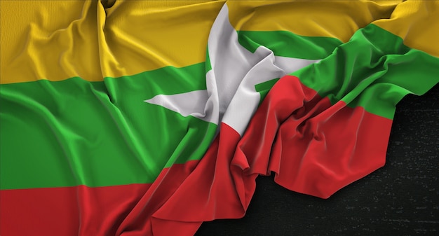 Free photo myanmar flag wrinkled on dark background 3d render