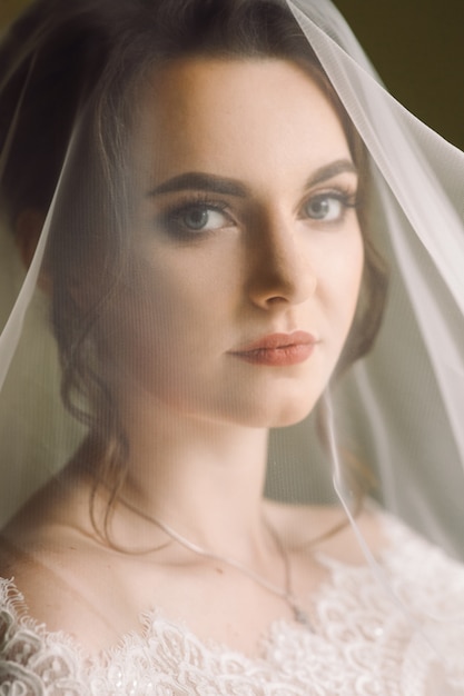 Mysterious portrait of a bride hidden under the veil