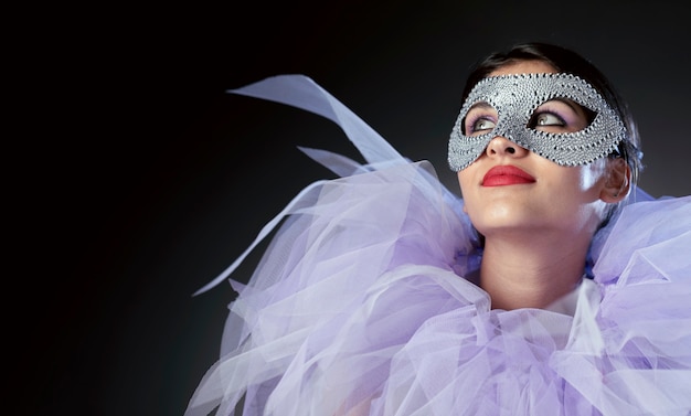 Mysterious woman with carnival mask