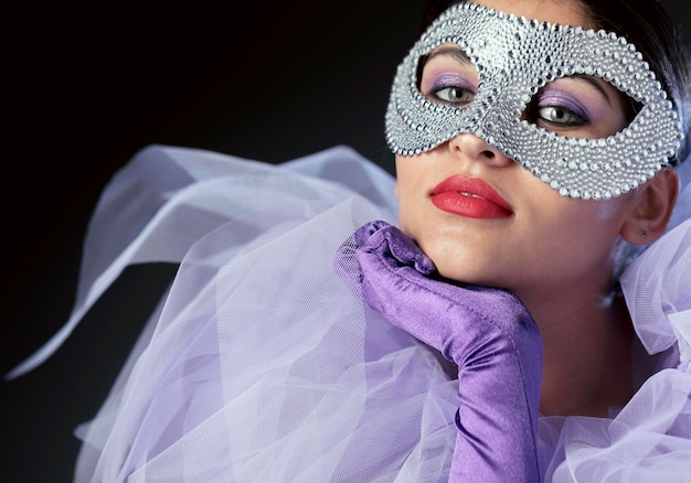 Mysterious woman with carnival mask