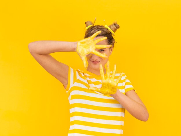 Mysterious woman with paint on hands