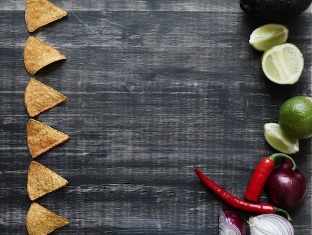 Free Photo nachos with lime and onion on the table