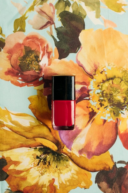 Free photo nail polish on floral surface