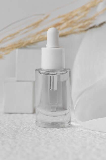 Nail serum with transparent bottle and plant