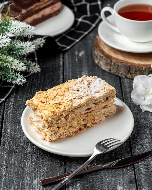 Free Photo napoleon cake with black tea on the table