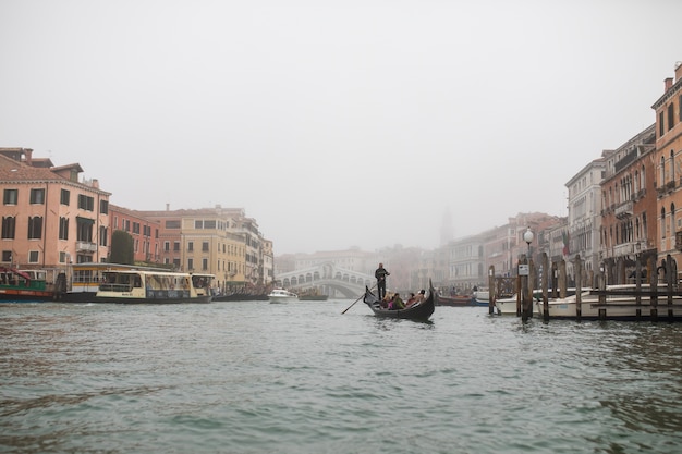 Free Photo narrow canal among old colorful brick houses in venice, italy.