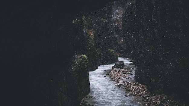 Free Photo narrow stream flowing through rocky formations