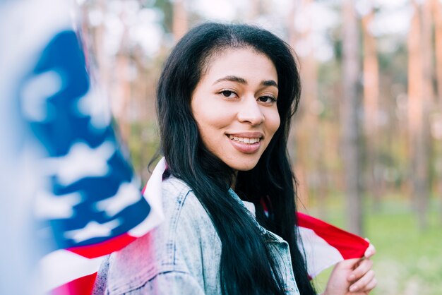 Native American woman with USA flag