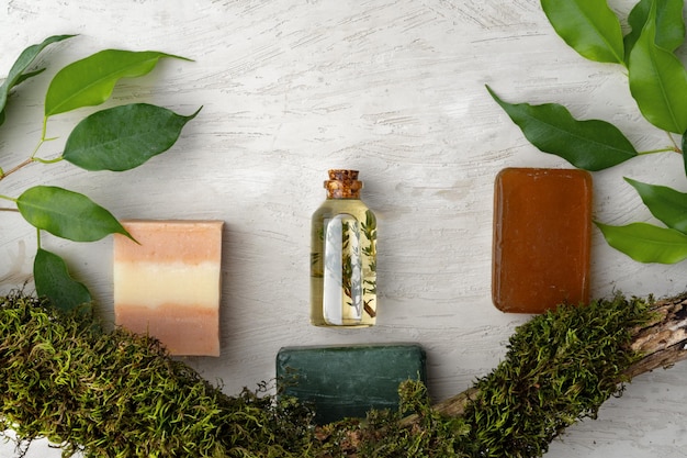 Free Photo natural handmade soap and plants on gray background