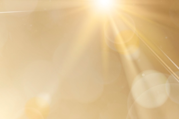 Free photo natural light lens flare on gold background sun ray effect