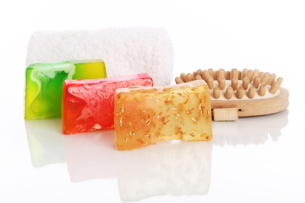 Natural soap with white towel and brush