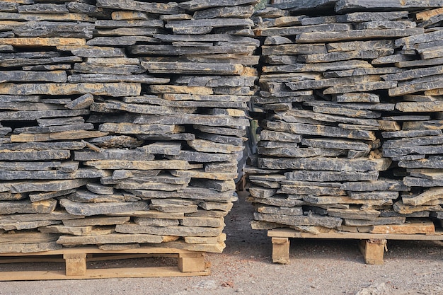 Free Photo natural stone slabs for finishing and decorating interior and exterior walls of buildings on pallets selective focus goods in stock construction and repair delivery and sale of building materials