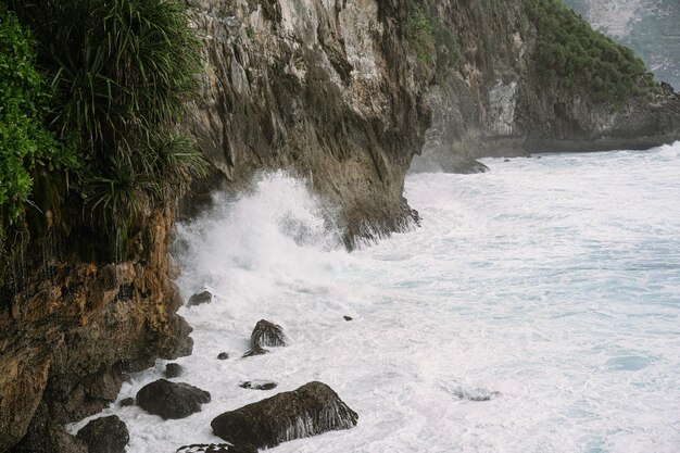 Natural views of Nusa Penida. Rocks and ocean. Peguyangan temple in Nusa Penida Island - Bali. Peguyangan Waterfall