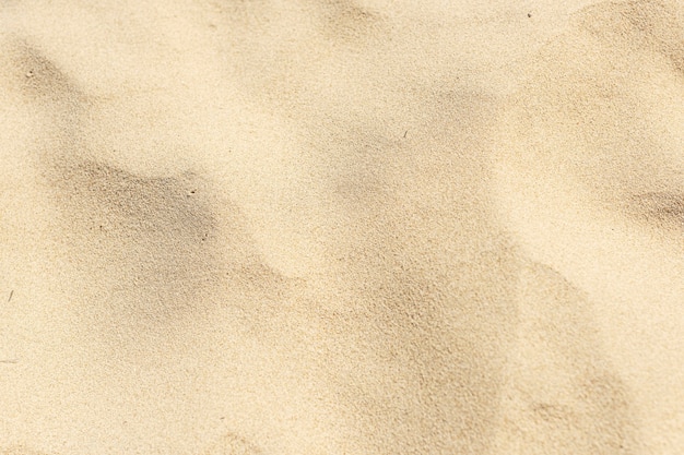 Free Photo natural yellow sand on the beach background