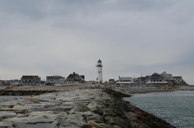 Free photo neighborhood with old scituate light standing tall.