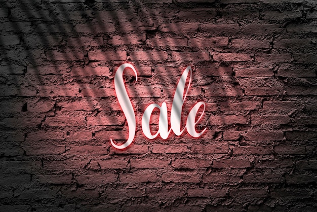 Free photo neon red sale sign on a brick wall