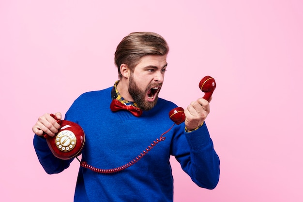 Free photo nervous man arguing during phone call