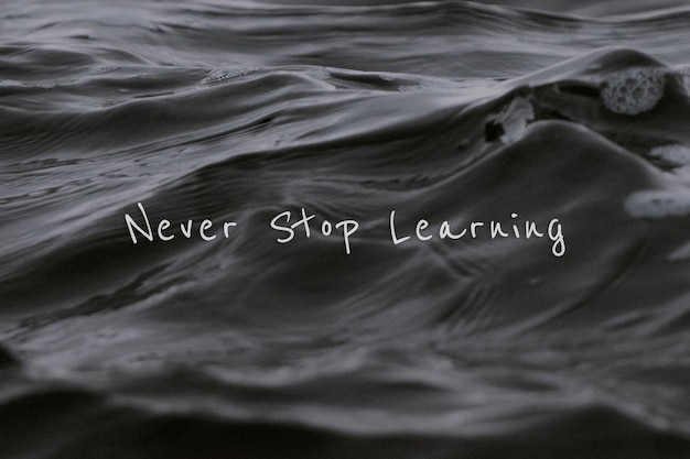 Never stop learning quote on a sea wave