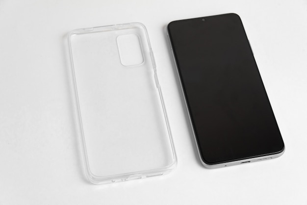 New cellphone with transparent cover over isolated white background