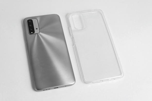 New cellphone with transparent cover over isolated white background