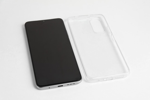 New cellphone with transparent cover over isolated white background