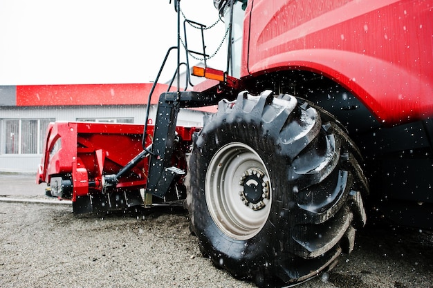 Free photo new red combine harvester at snowy weather