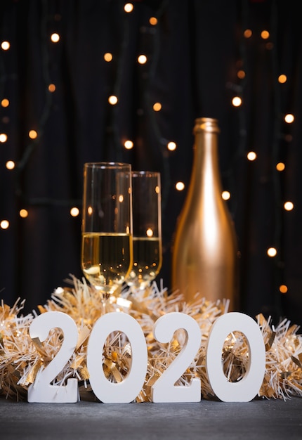 Free Photo new year 2020 with champagne bottle