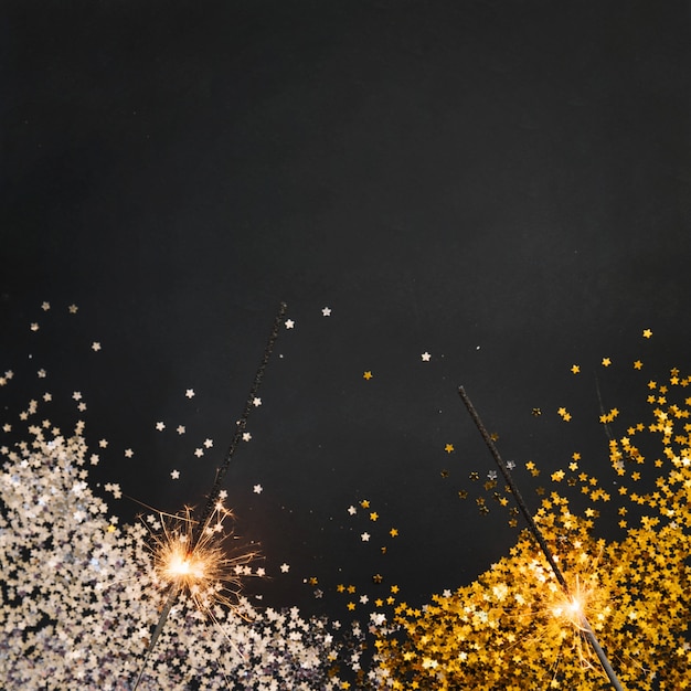 Free Photo new year background with confetti and sparklers