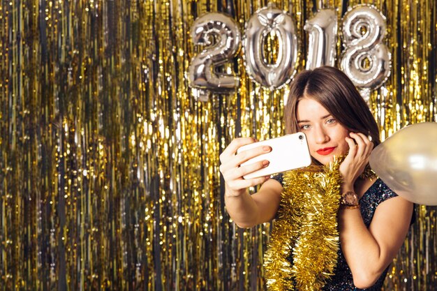 New year concept with girl taking selfie