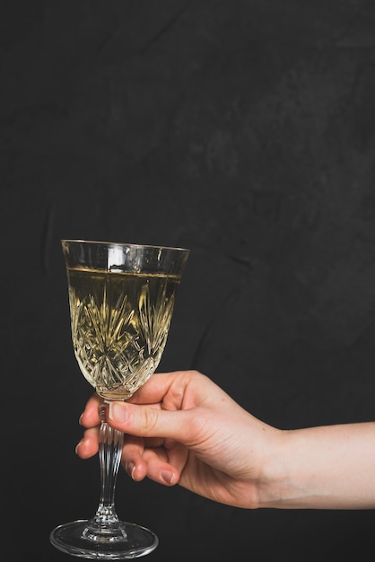 New year concept with hand holding champagne glass