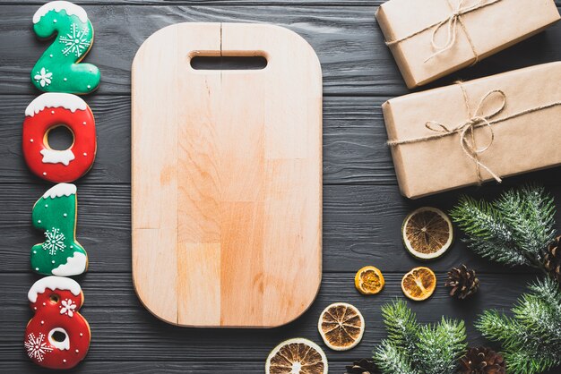 New year concept with wooden board and presents