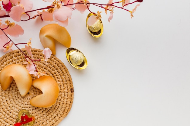 New year fortune cookies and flowers top view