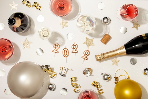 Free photo new year party arrangement with champagne bottle