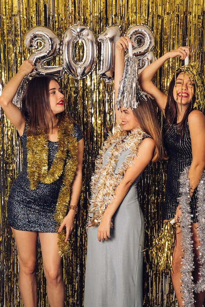 New year party with three girls celebrating