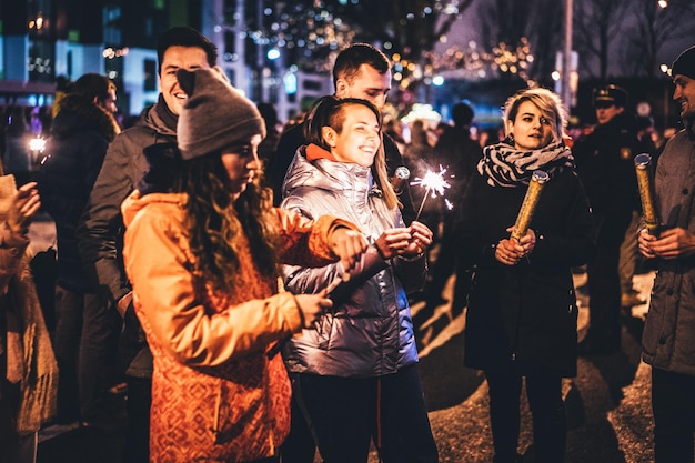 Free Photo new year with friends sparklers