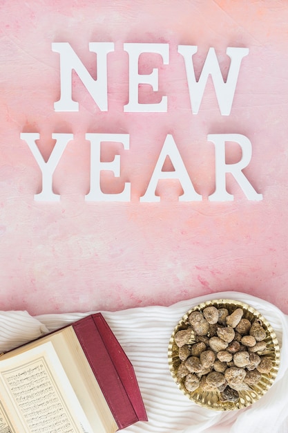 Free photo new year word with koran and sugar