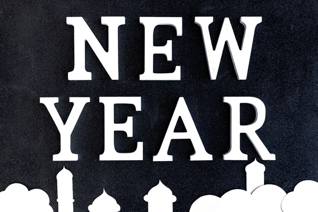 New Year words and Islamic building silhouette