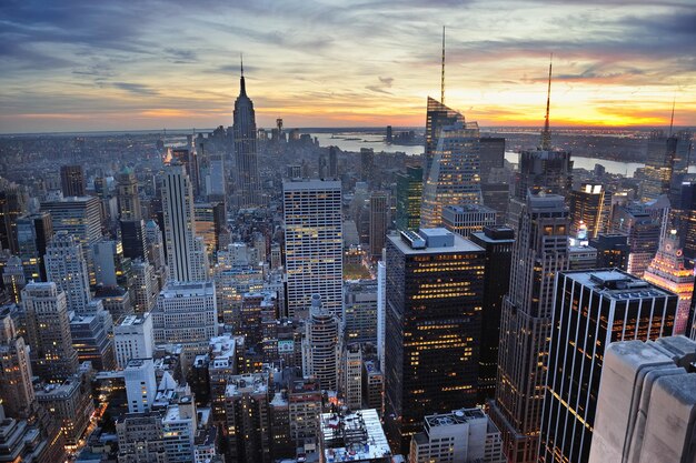 New York City skyline with urban skyscrapers at sunset.