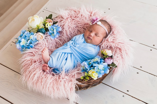 Newborn baby sleeping in basket