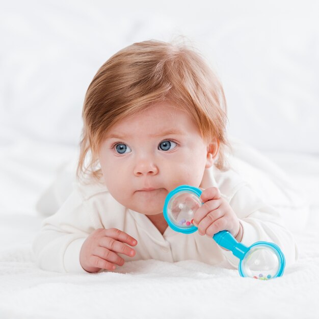 Newborn posing with toy