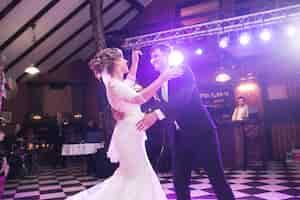 Free photo newlyweds dancing on the dance floor