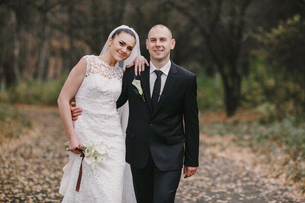 Newlyweds walking in the field